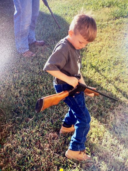 The young author loading his .410 shotgun.