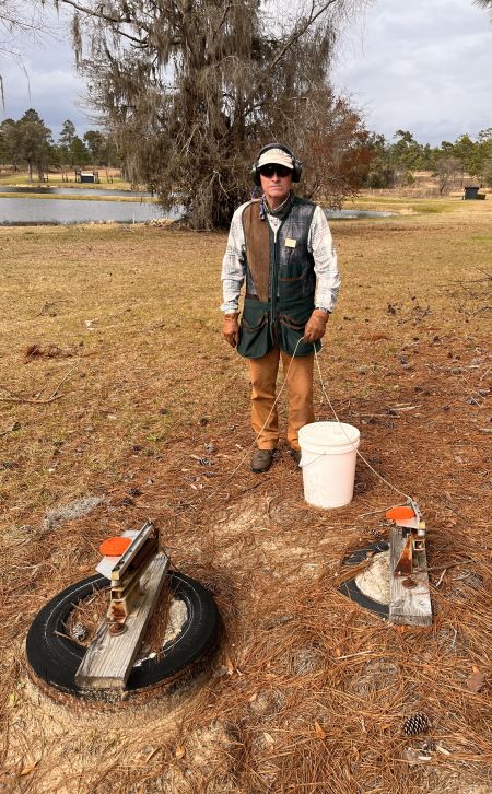 Instructor Truel Meyers ready to throw a pair of targets from the Quail Walk hand trap machines.