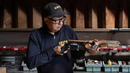 At Grip Plus, Sai Chiang Will Make You the Most Accurate Shotgun Grip on the Planet 2 Sai Chiang in his shop examining a Grip Plus stock.