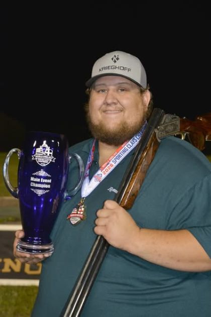 Braxton Oliver with his World English Sporting Clays Championship cup.