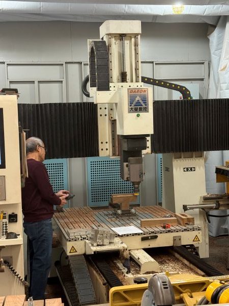 A Scientific Quest for Zero Recoil Leads a Physicist to Silicon Valley’s Grip+ 7 Chuck Poon aligns a wood blank on the CNC machine. This step translates the approved digital stock design into precise cuts, shaping the blank toward the custom geometry needed for proper fit.
