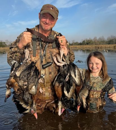 Chenier Shotshell owner Damon Herbert duck hunting with daughter, Savannah.